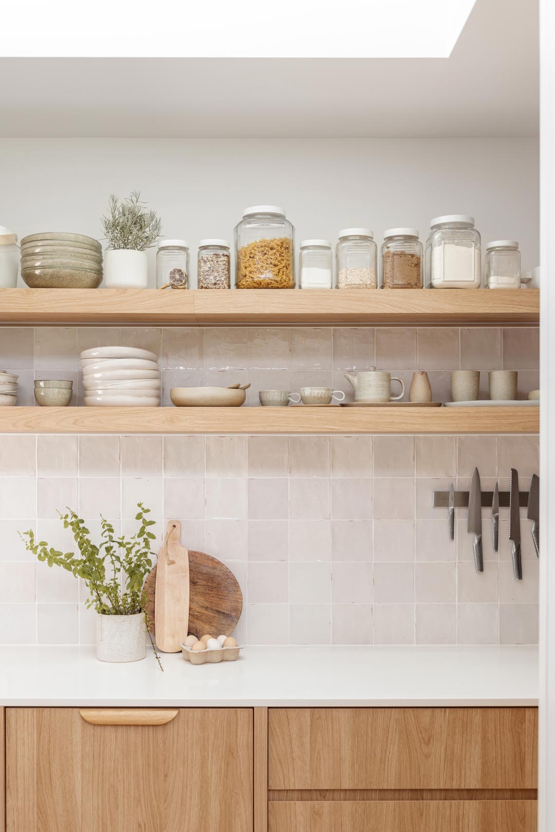 A-butlers-pantry-utilises-the-walls-as-storage-by-installing-exposed-shelves-and-a-magnetic-knife-rack-to-keep-things-off-the-kitchen-bench