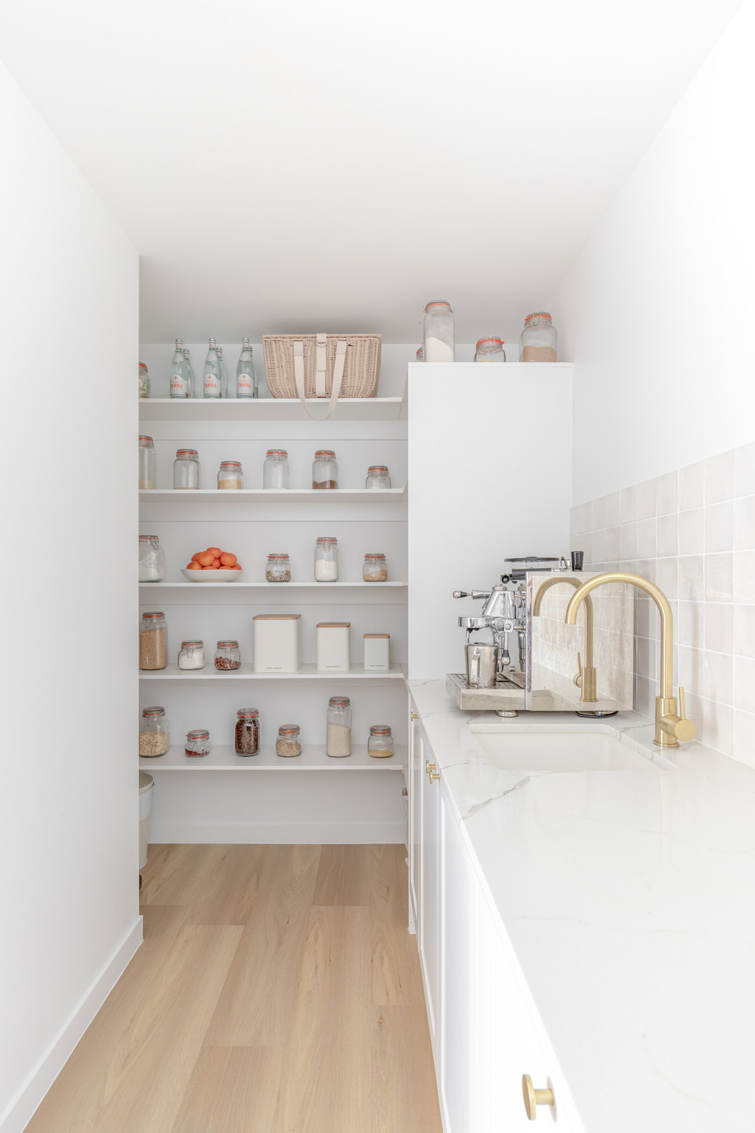 A-neat-tidy-kitchen-butlers-pantry-filled-with-labled-glass-jars-and-containers-to-keep-your-pantry-organised-and-hide-coffee-machines-and-appliances