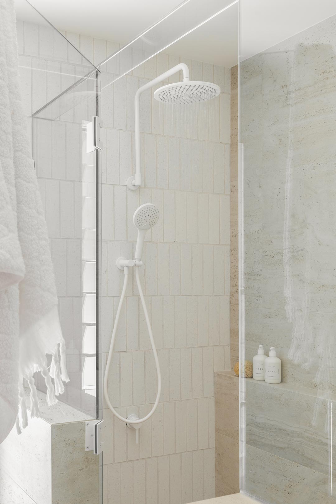 A-neutral-bathroom-with-white-tapware-creates-an-aesthetic-spa-like-shower-experience